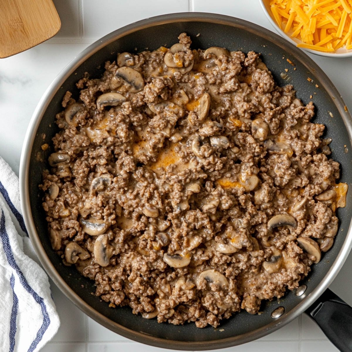 Heat a large skillet over medium-high heat. Cook and stir ground beef in the hot skillet until completely browned and crumbly, 7 to 10 minutes. Stir in condensed soup; season with salt and black pepper.