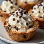Easy Cannoli Cookie Cups Recipe with creamy ricotta filling topped with mini chocolate chips on a white plate.