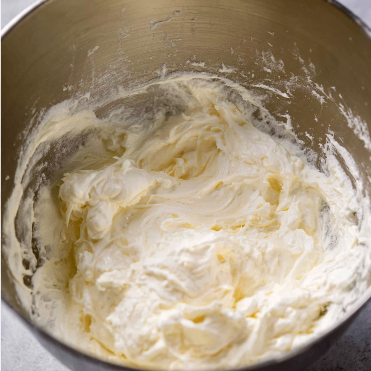 Add the whipping cream to a large bowl or stand mixer. Beat it with electric beaters for about a minute or two until it starts to thicken up.