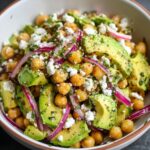 Chickpea Feta Avocado Salad with red onion and herbs tossed in a lemon-herb dressing.