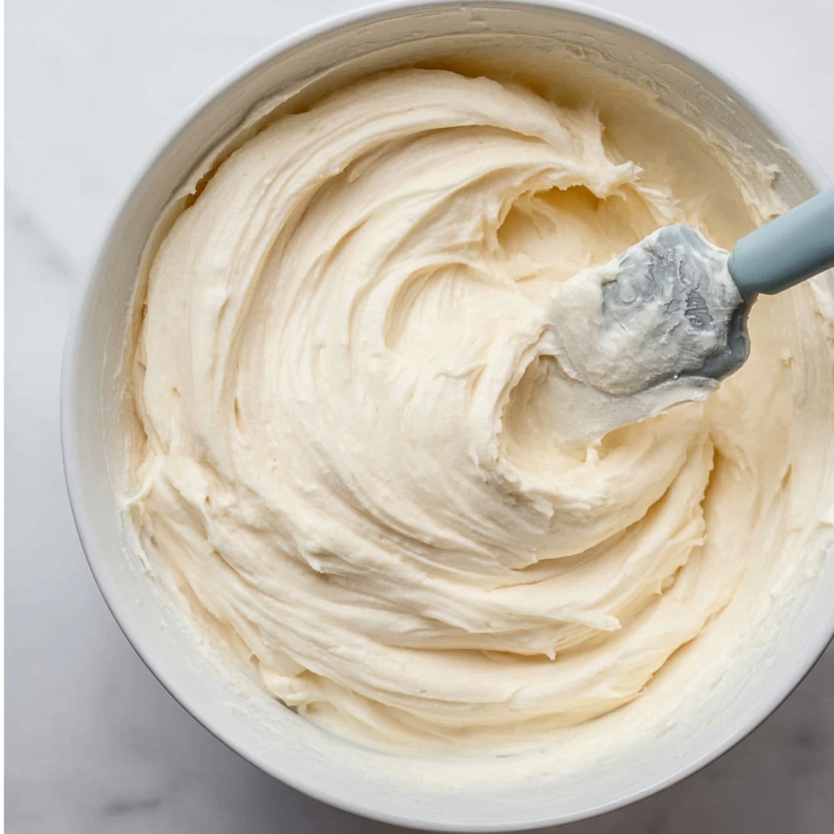 In a large bowl, use a hand mixer or stand mixer with a paddle attachment to beat the softened butter on high speed for 1 minute until it's creamy. Add the confectioners' sugar and beat on medium speed for 1 to 2 minutes. Add the heavy cream and vanilla extract, then beat on high speed for 2 to 3 minutes until the filling is smooth and fluffy. Taste it and add a pinch of salt if needed. If the filling seems too thick, add a tablespoon of room-temperature heavy cream to loosen it up.