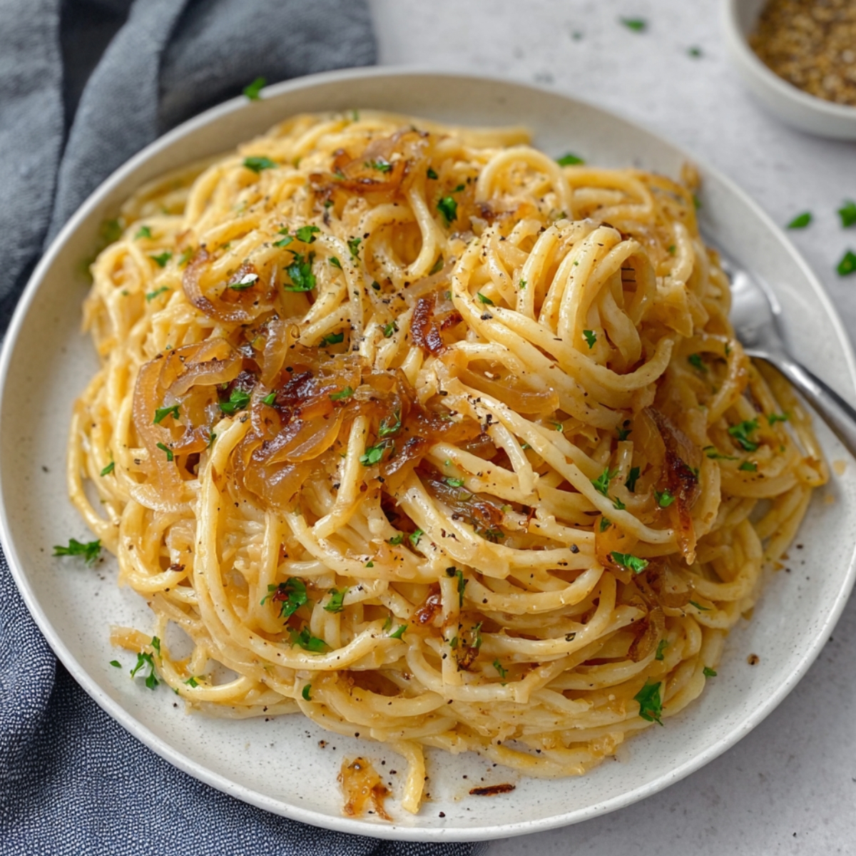 Caramelized Onion Pasta are combined in a pan, creating a flavorful and comforting dish.